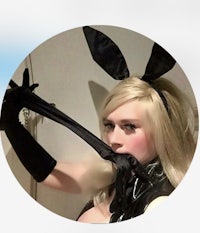 a woman in a bunny costume holding a knife